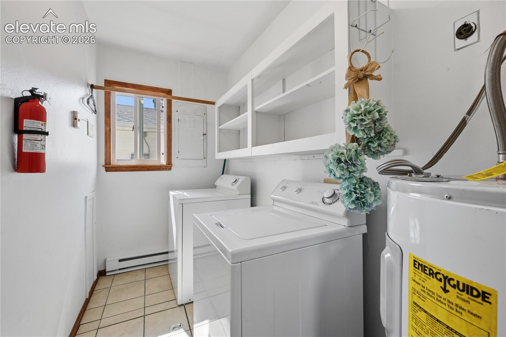 Dedicated laundry and utility room provides extra storage and convenient everyday functionality.