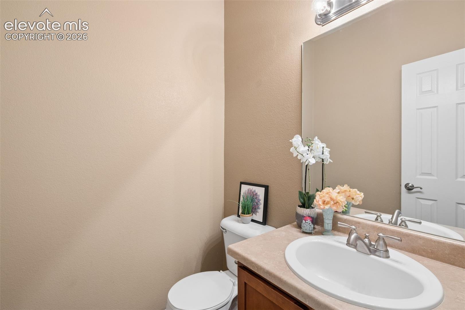 Bathroom Number 3 is a 1/2 Bath On The Main Floor