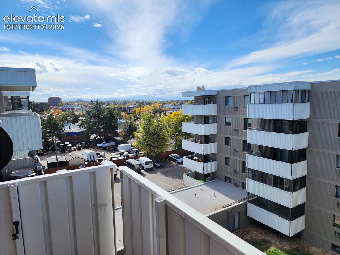 Outdoor balcony with vertical metal railing