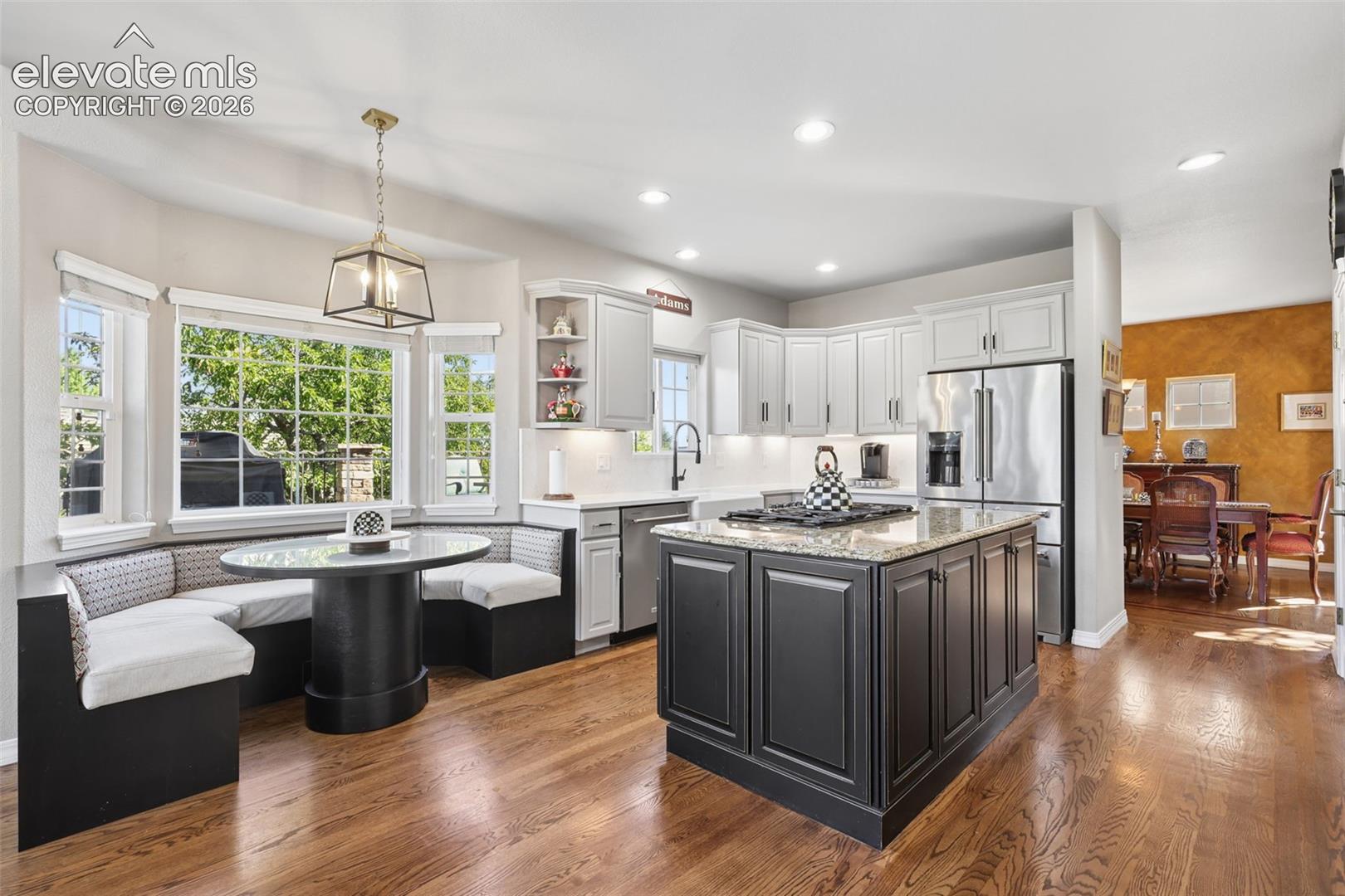 Gorgeous, remodeled kitchen with custom nook seating and table.