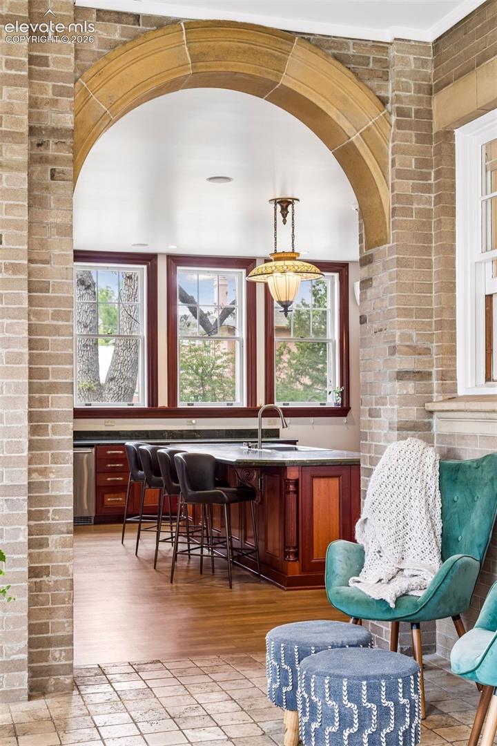 Original stone arch sunroom off of kitchen
