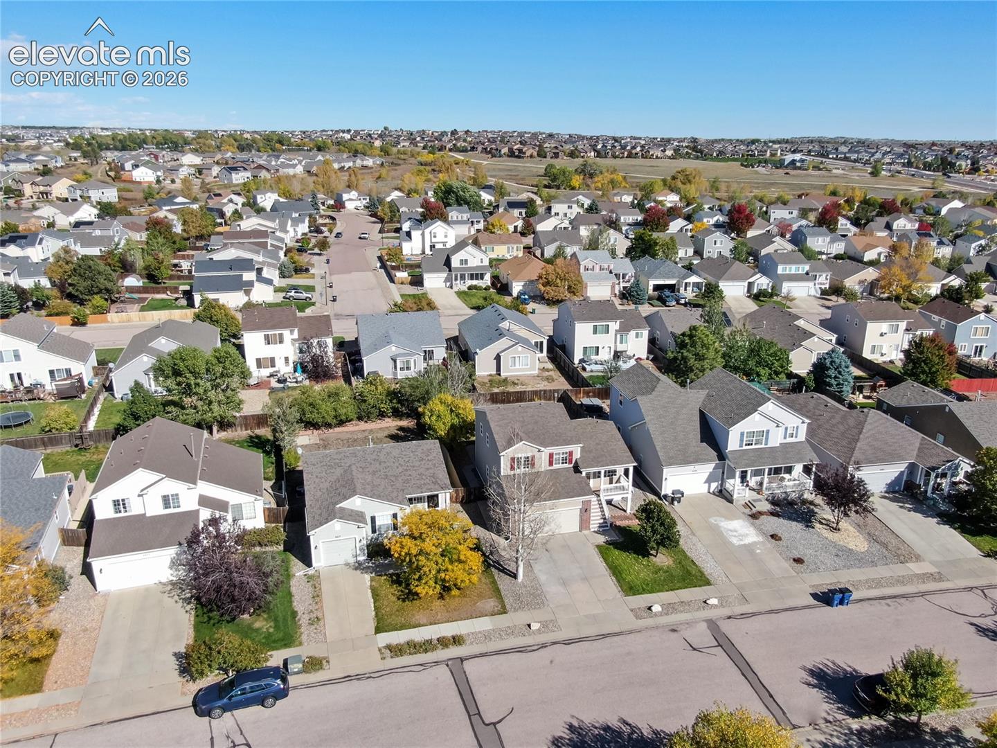 An aerial view highlighting the lot footprint, roof design, and fully fenced backyard perfect for outdoor relaxation