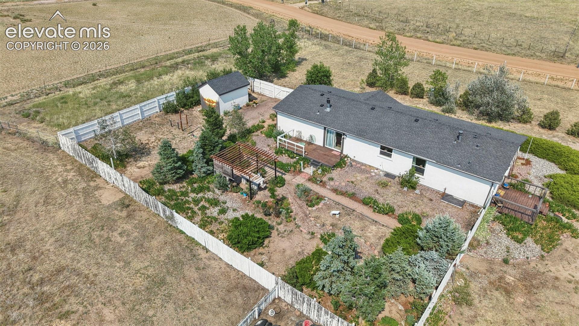 Back yard offers Deck, Pergola, Double Gate Drive Thru-Perfect for RV/Boat