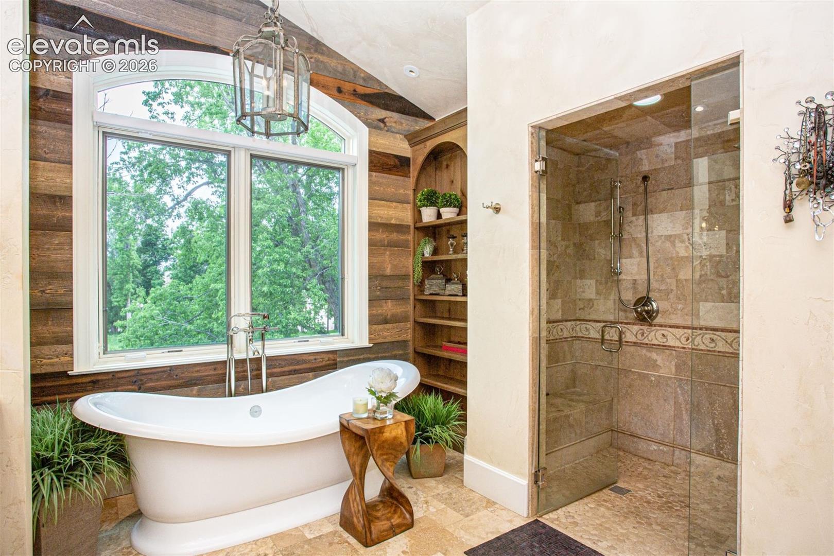 Freestanding soaking tub and steam shower.