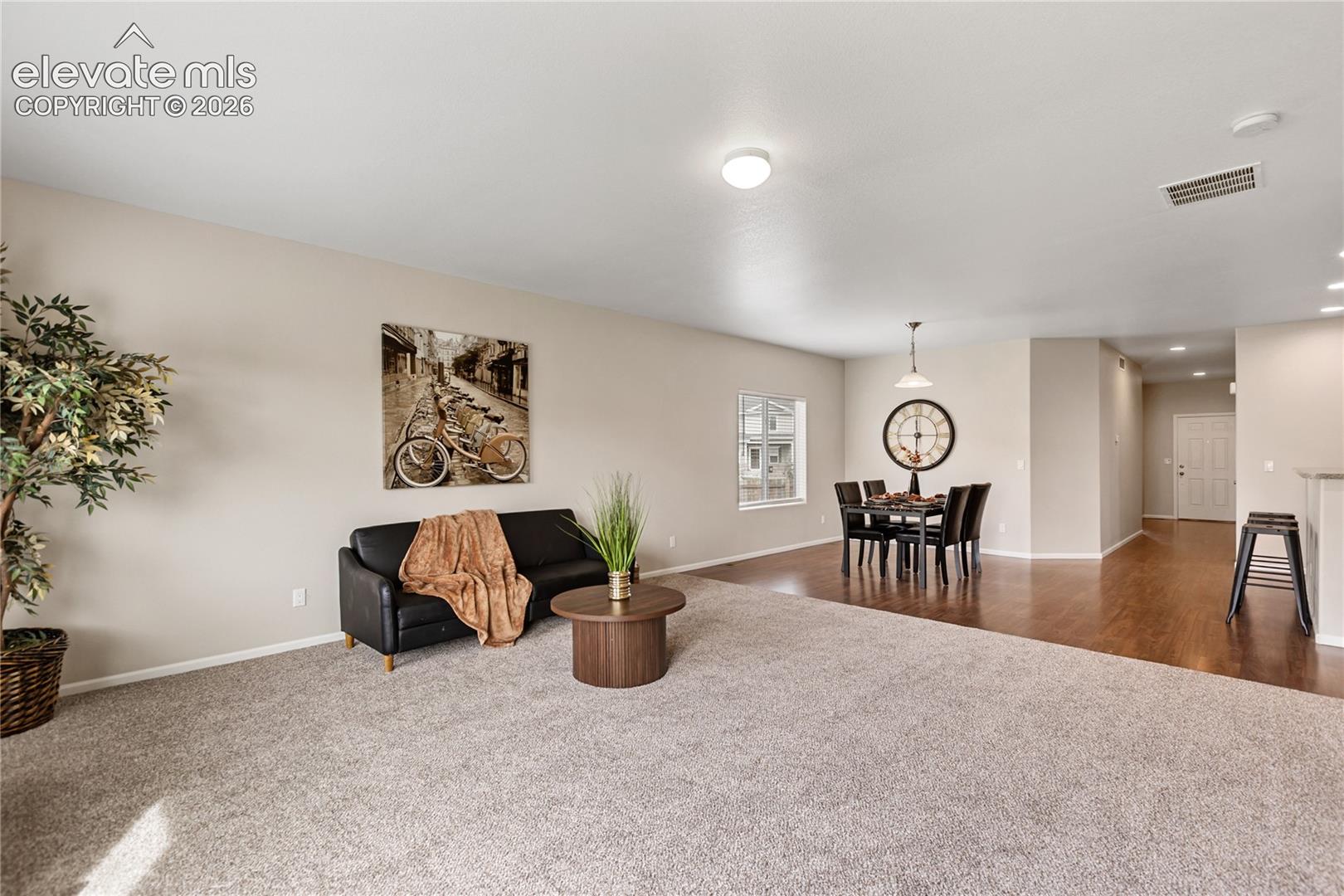 This living room is ready for large furniture - it's very spacious and features new carpet with upgraded pad and this sparkling clean home has been painted inside and out!