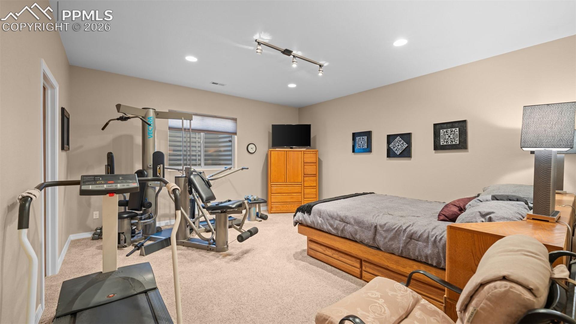 Bedroom currently set up as a home gym