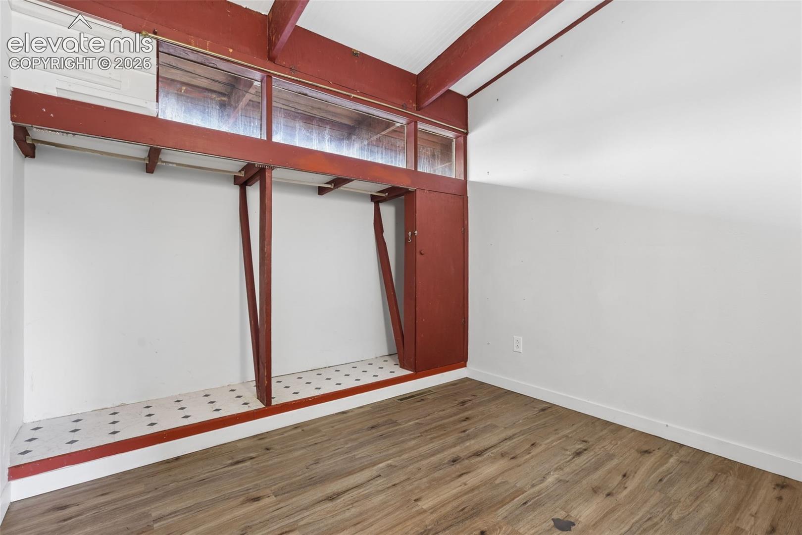 Wood-finish flooring with white painted walls