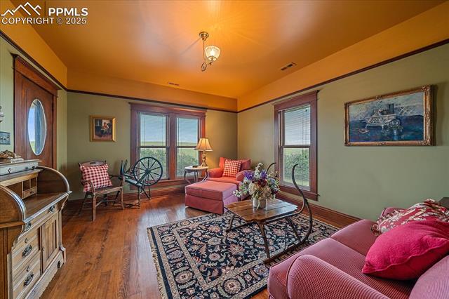 Living room featuring wood finished floors and baseboards