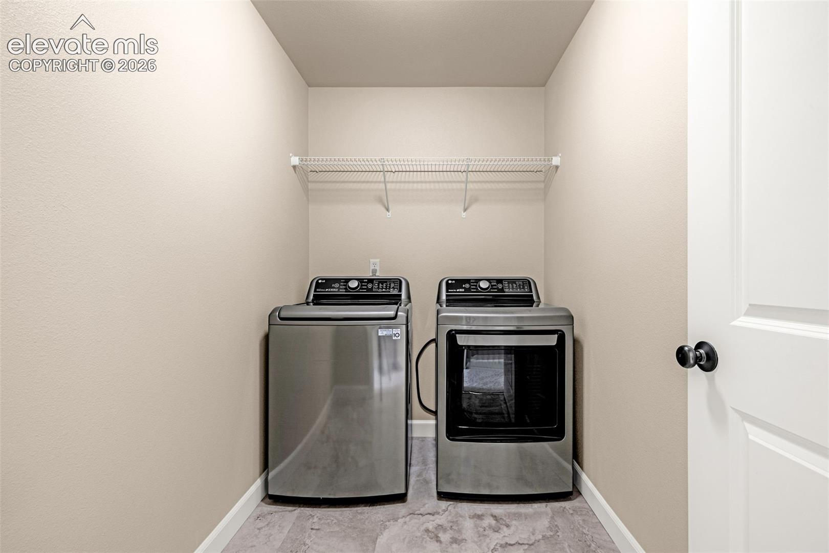 Upper level laundry area with new flooring, washer and dryer included.  Making chores easier with no stairs to climb.  