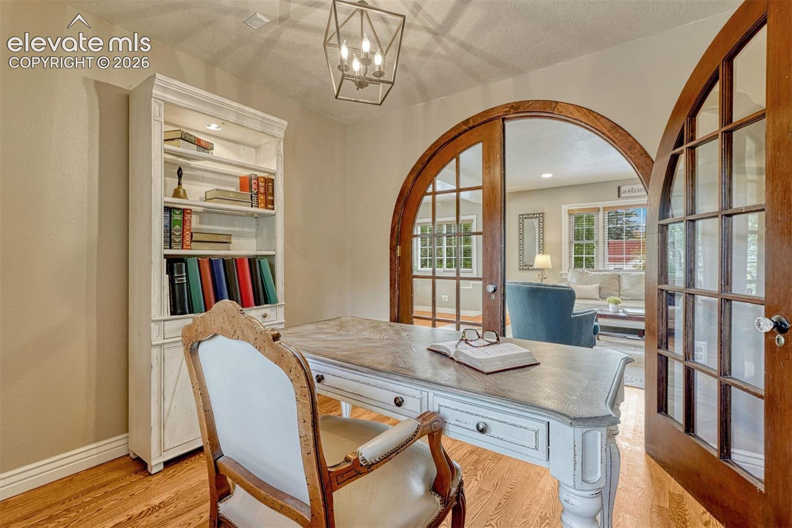 Main Level Office or Bedroom with custom doors.