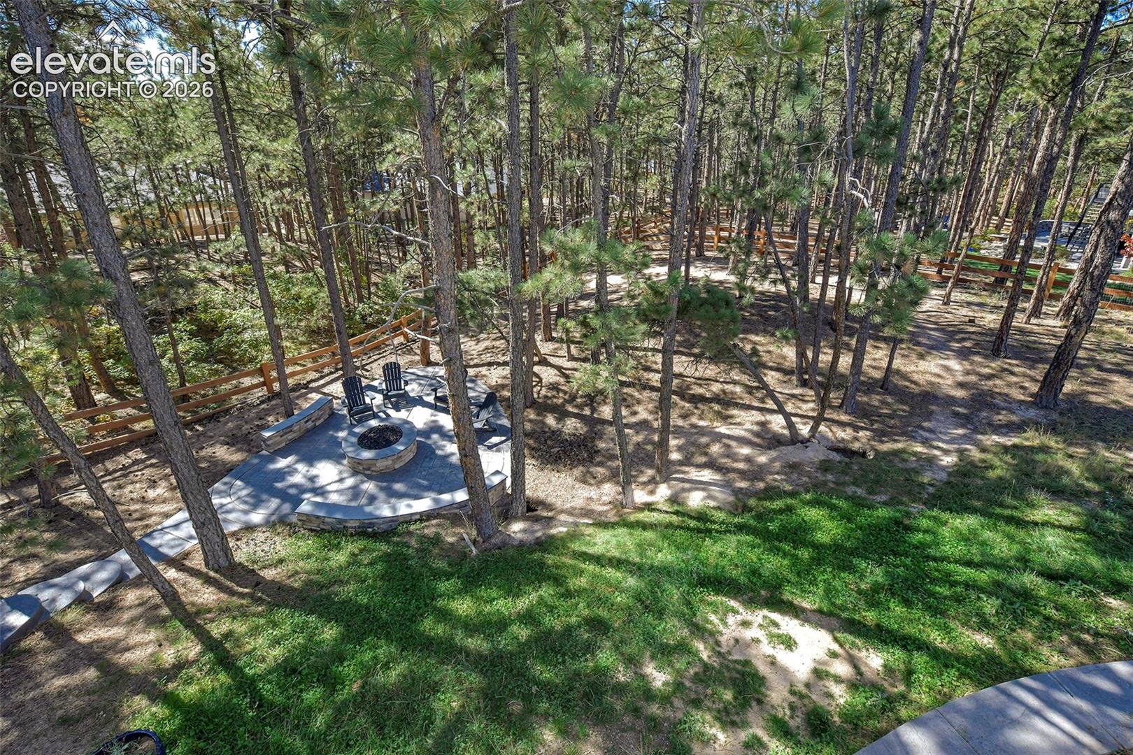 View of lower level firepit patio from upper deck