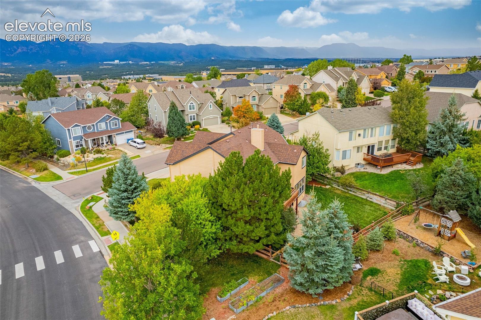 Expansive suburban neighborhood with mountain backdrop