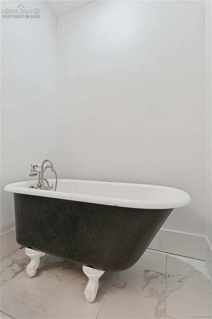 Main-level flat 2nd full
bath with clawfoot tub
and shower attachment
