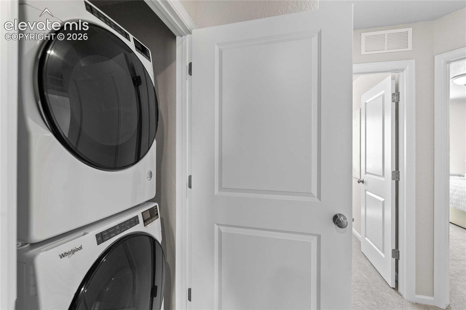Stackable washer and dryer appliances within a closet
*photos of a model home*