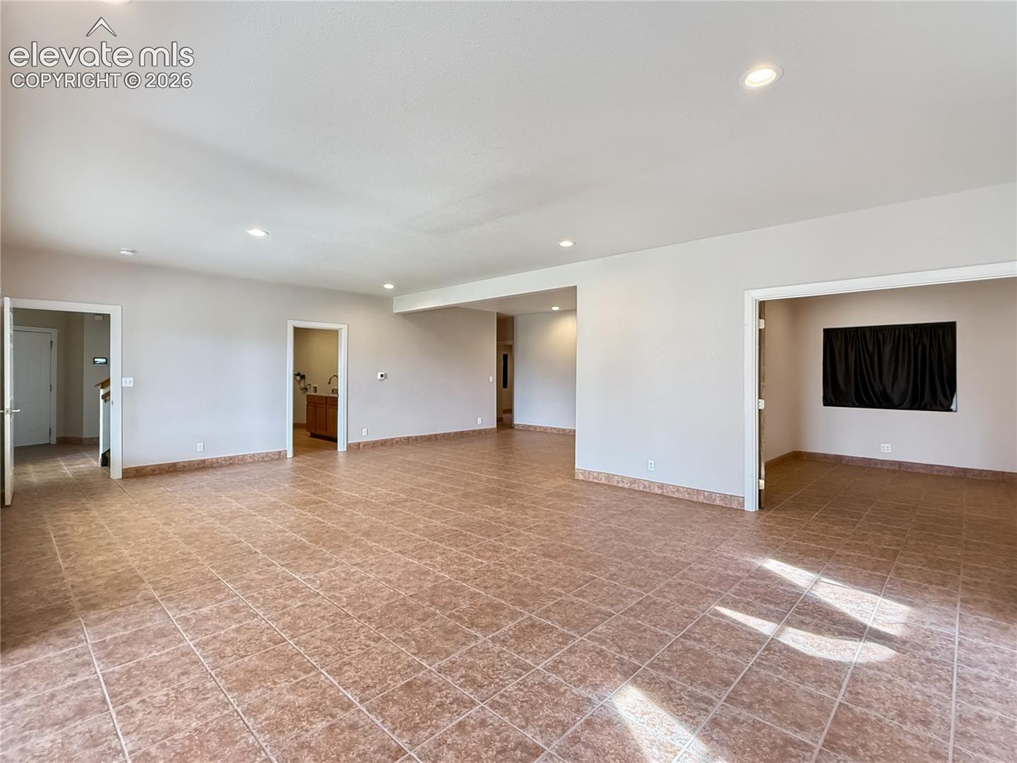 Another view or large game/family room looking into office and laundry room