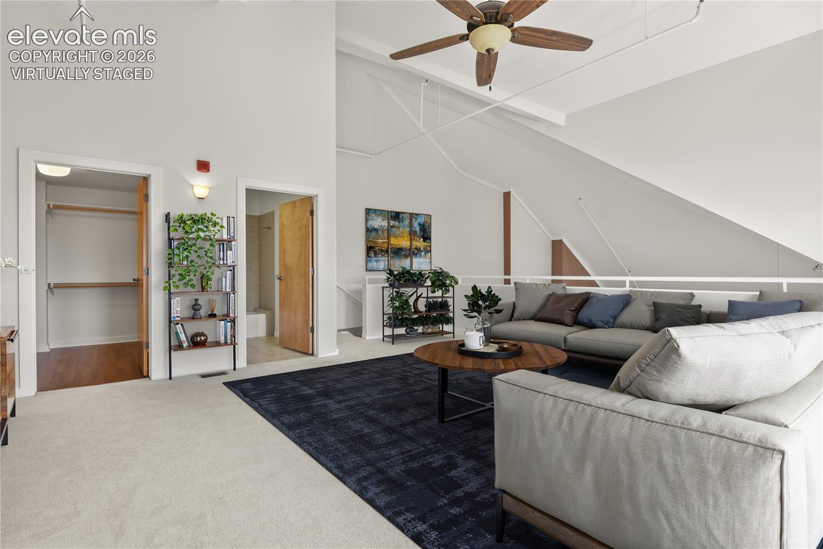 Upper level lofted area with abundant storage and full bath. Virtually Staged
