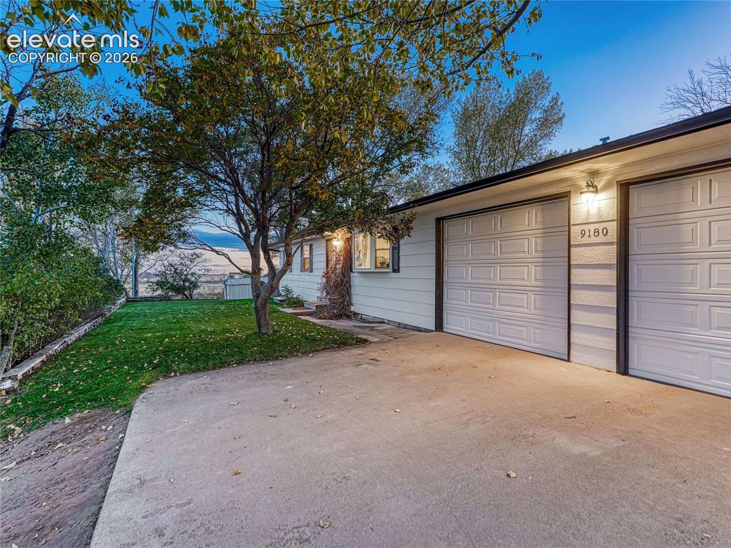 2-car attached oversize garage w/ room to workshop.