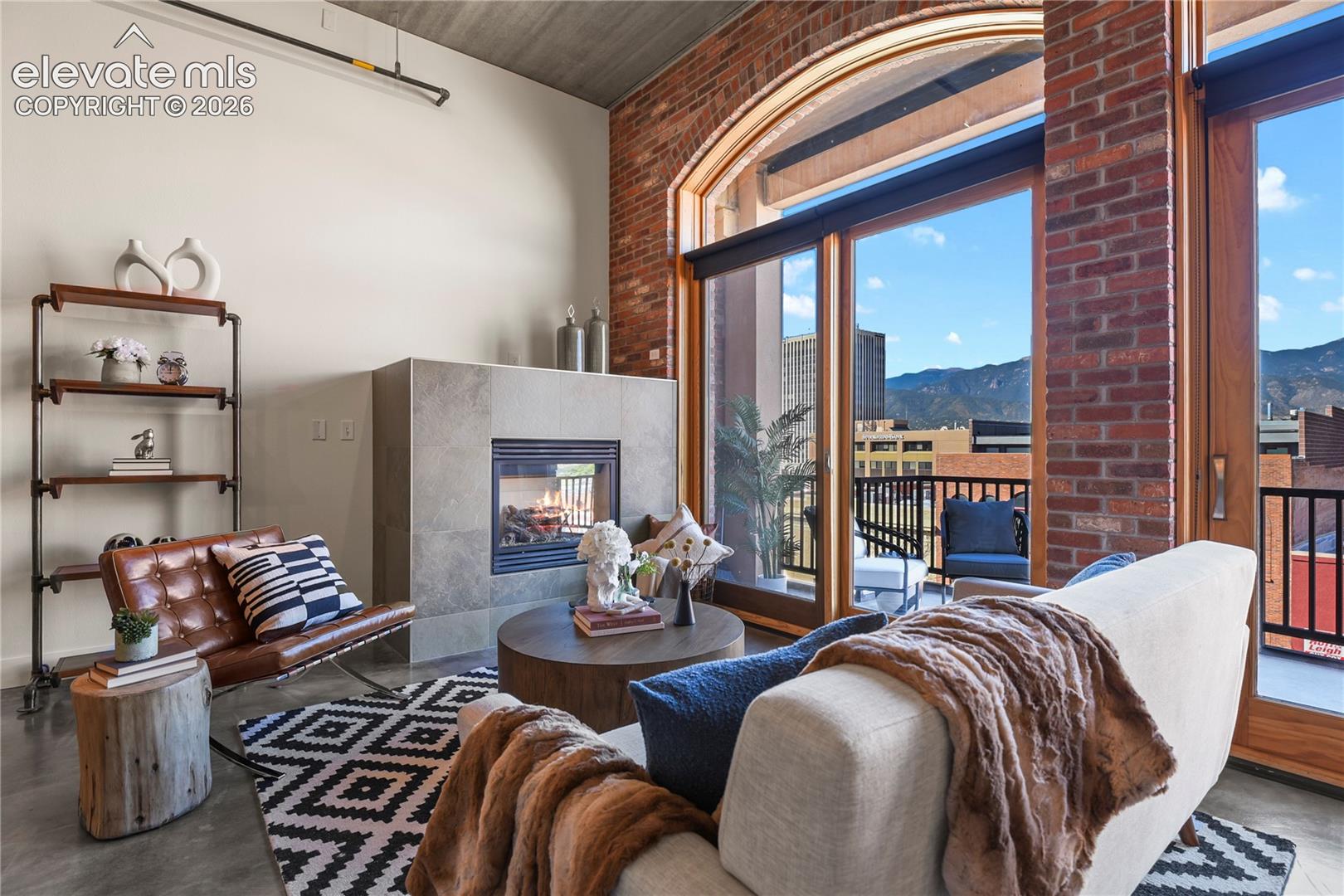 Gas fireplace encased with oversized modern tile