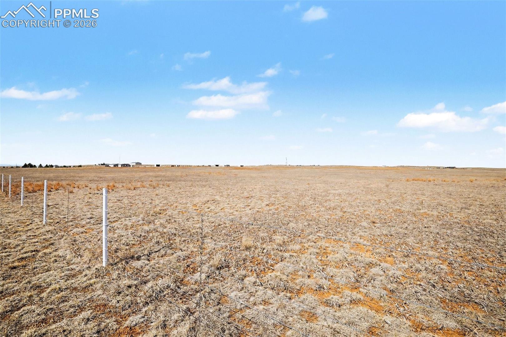 View across the property highlighting wide-open skies and open space.
