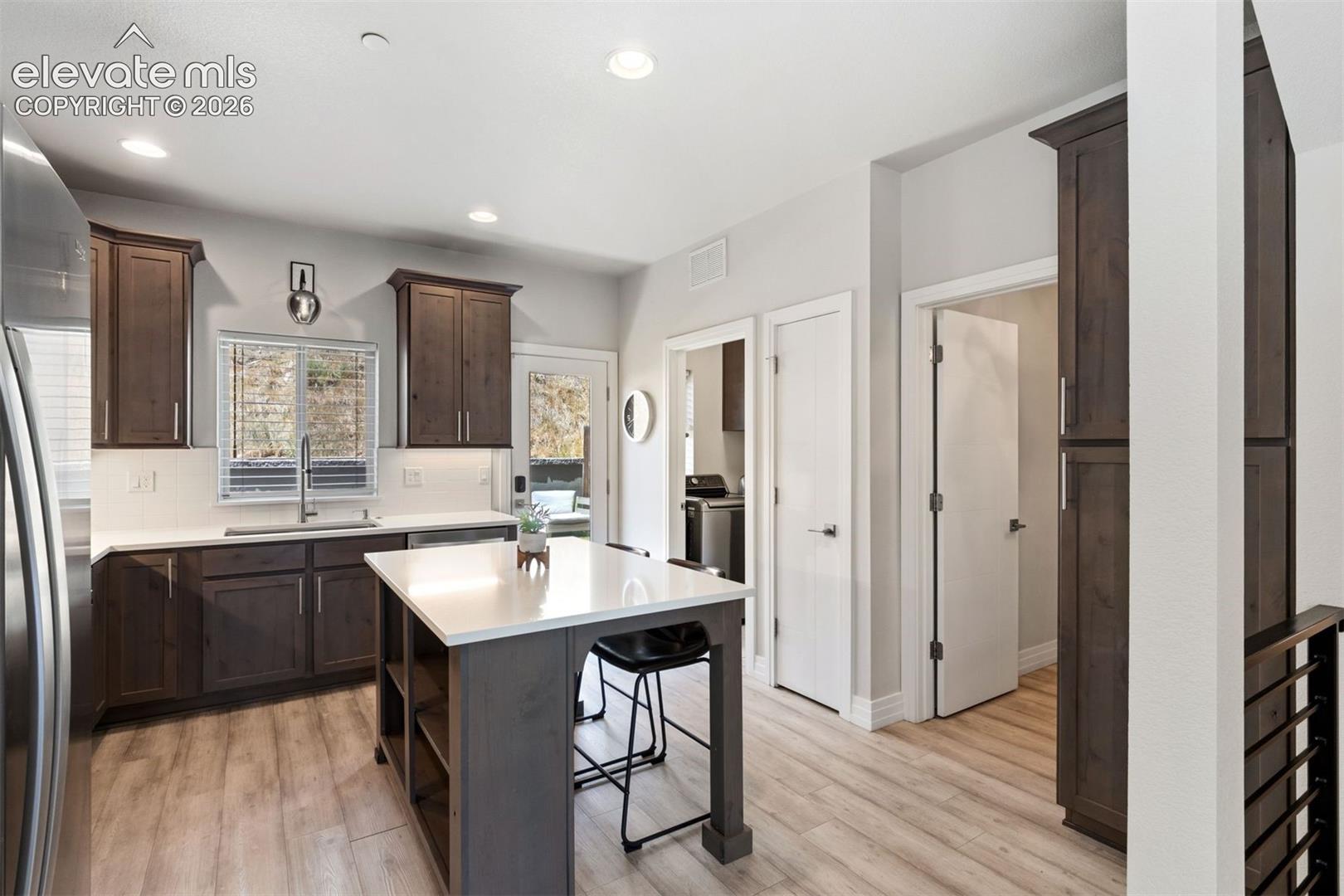 Kitchen with center island walk out access to back yard