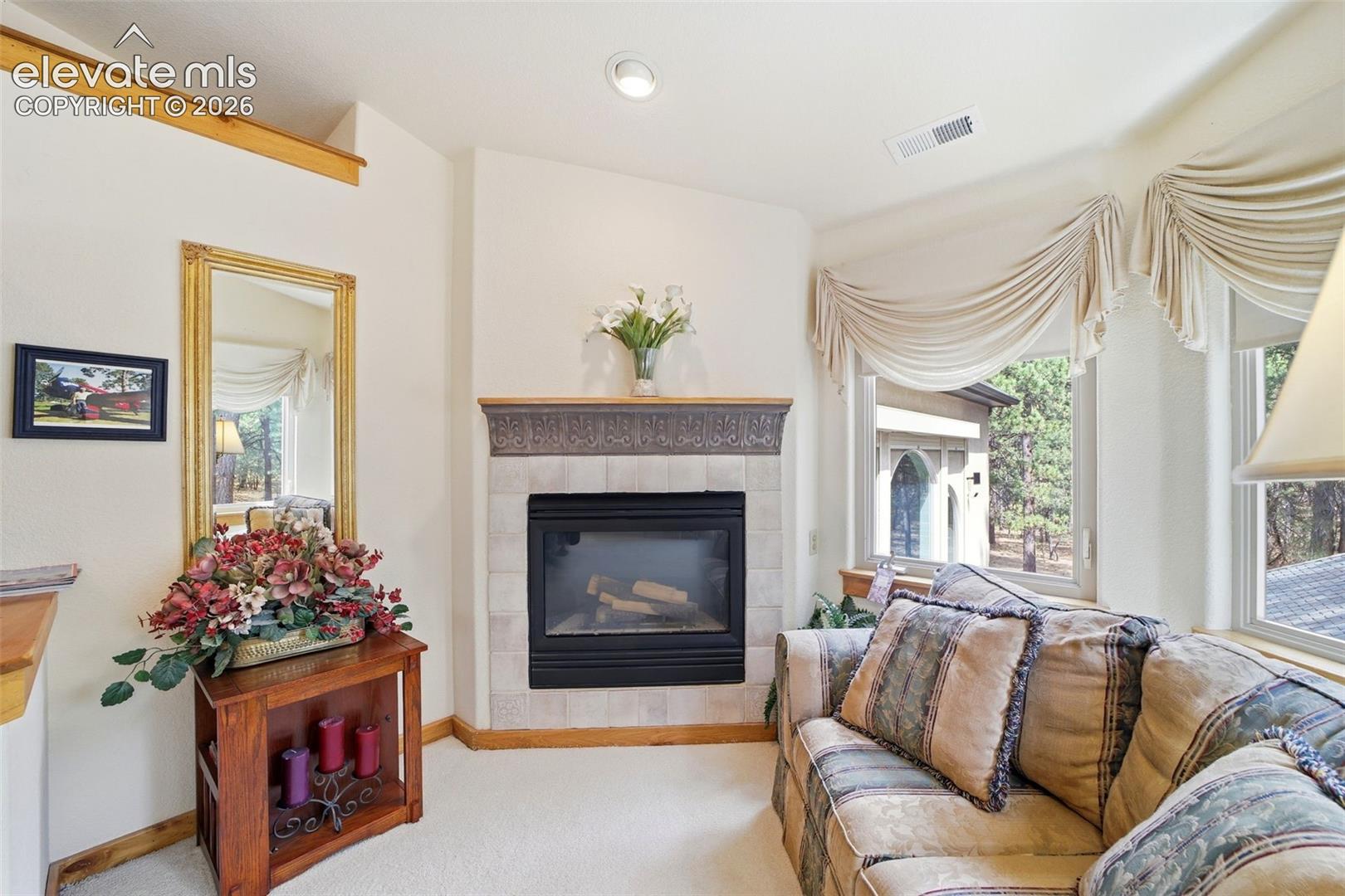 Private sitting room with fireplace in the Master Bedroom suite