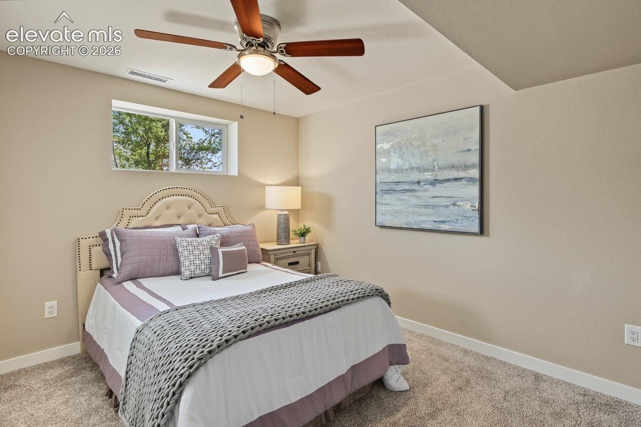 Lower level fourth bedroom. New ceiling fan and carpet