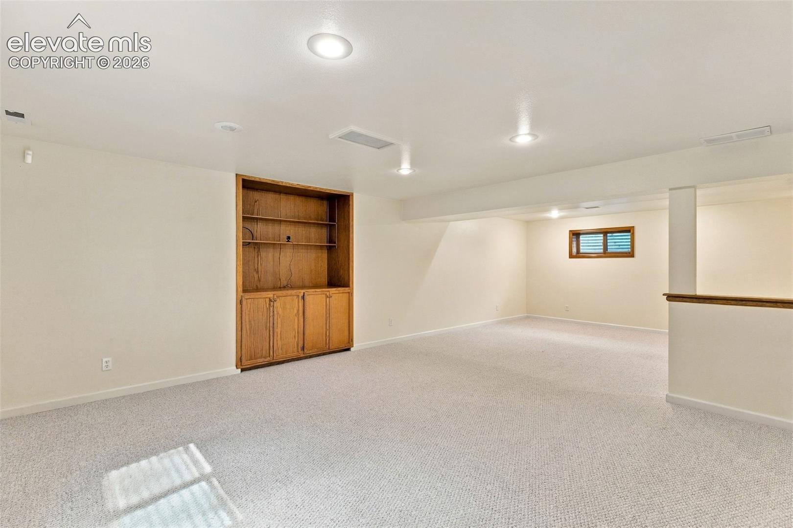 Basement rec room with built-ins.