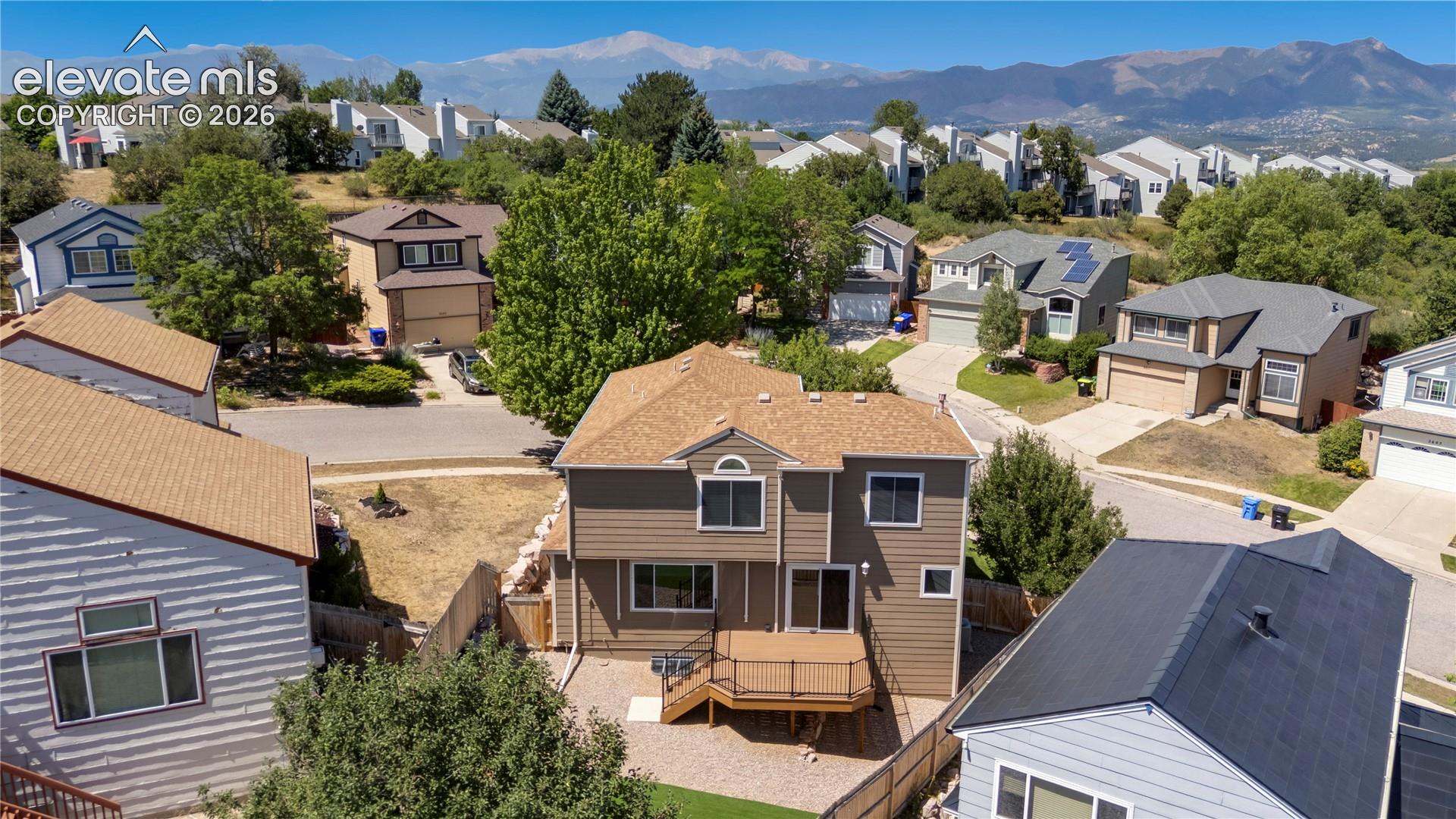 Aerial view back of home, 2 different kinds of apple trees in yard