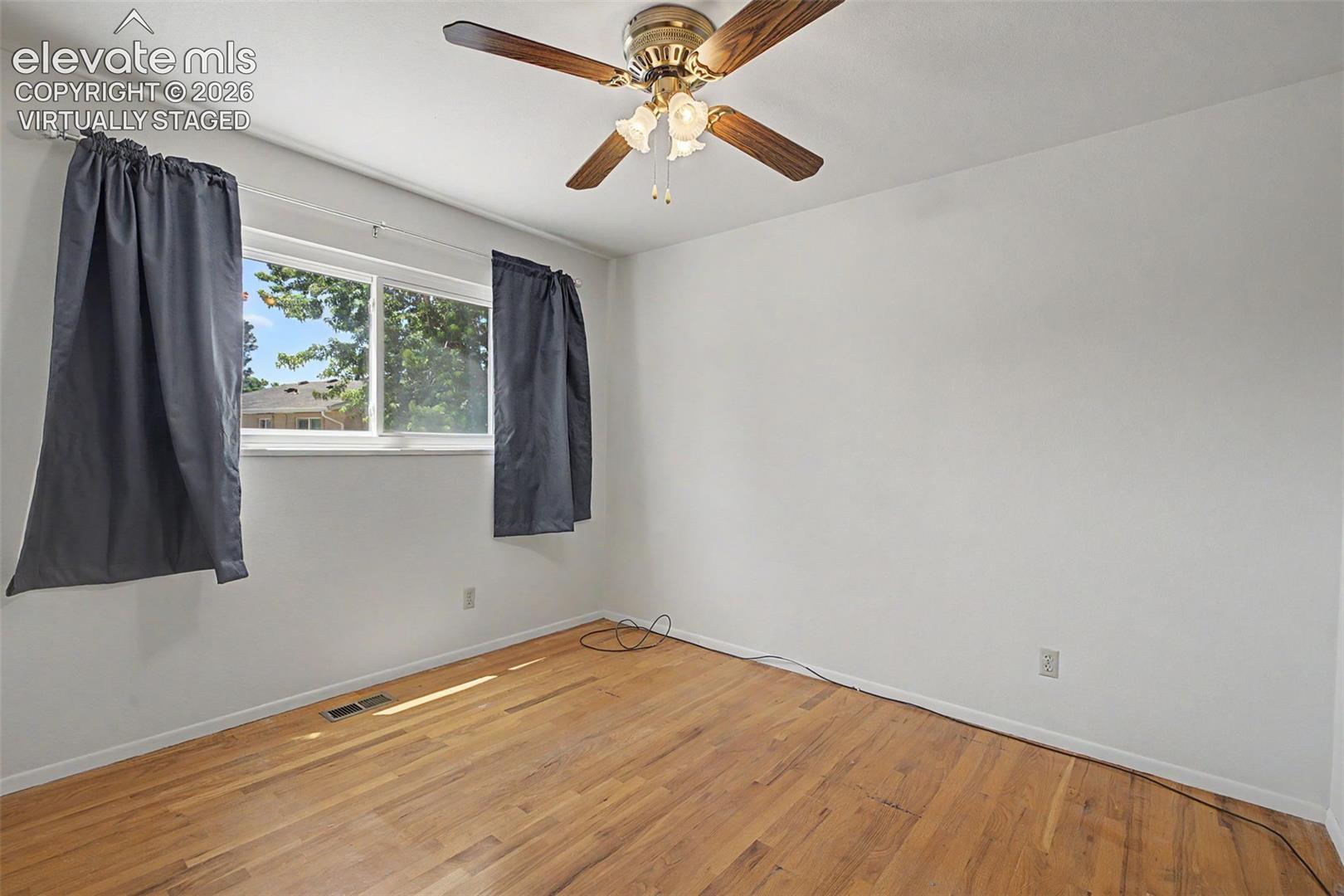 Virtually Staged with flooring - wood flooring under carpet