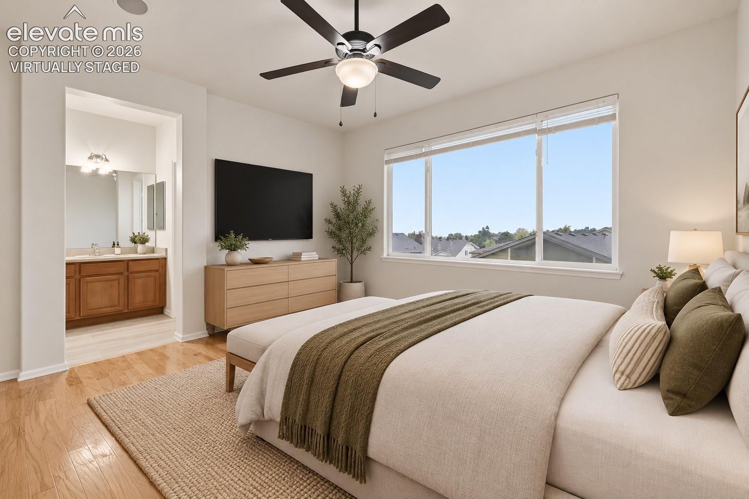 Primary Suite with Ceiling Fan, Pikes Peak Views and Wood Laminate flooring! Virtually Staged