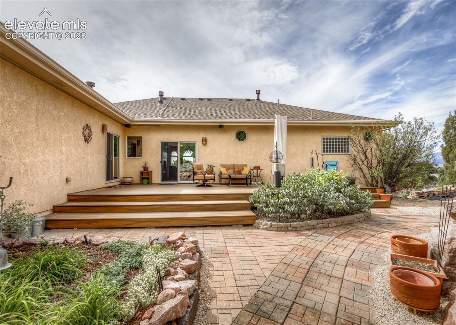 Step out to this serene backyard from multiple access points and enjoy the peacefulness, mature trees, birds, plants and privacy. 