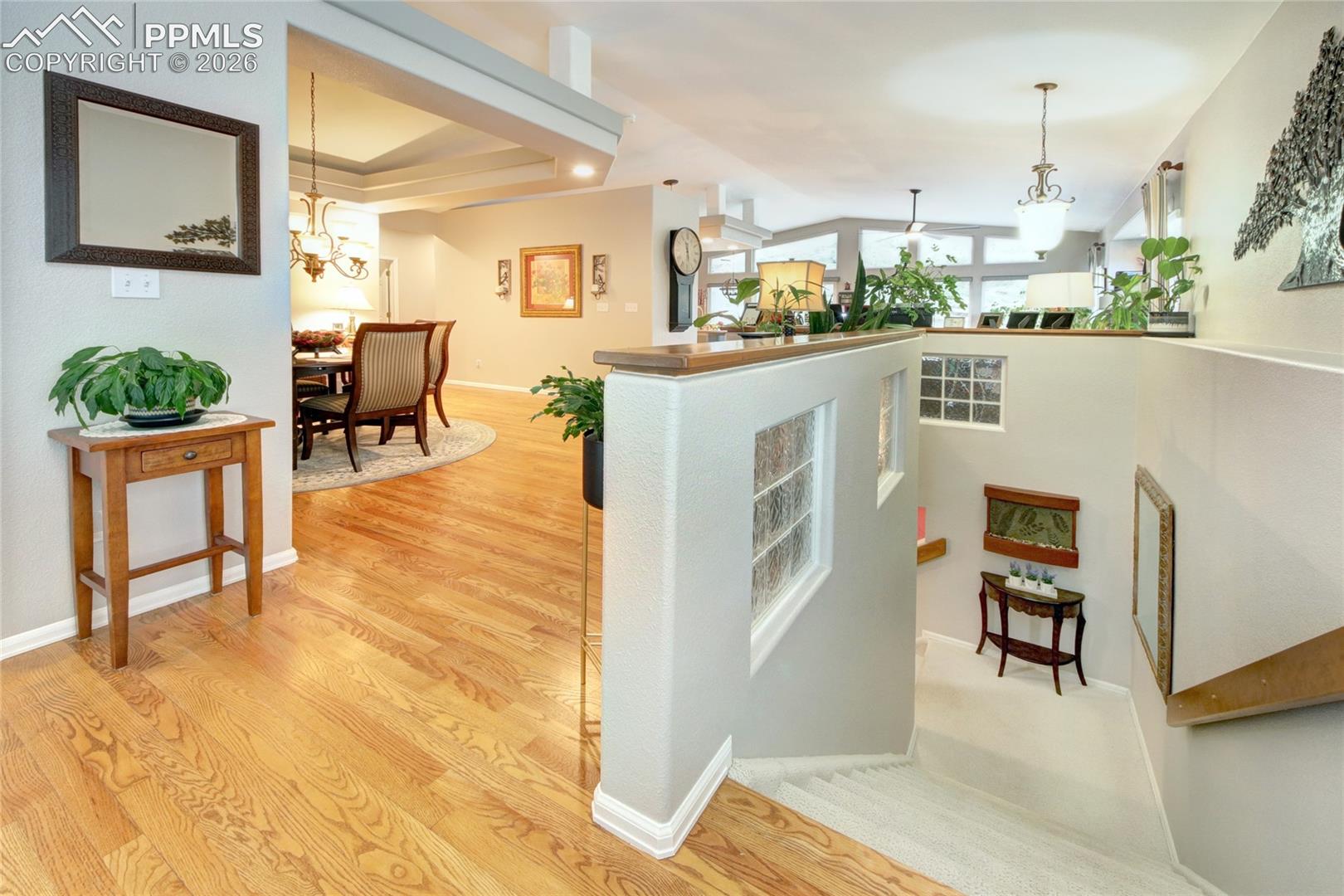 Foyer hardwood looking down to basement