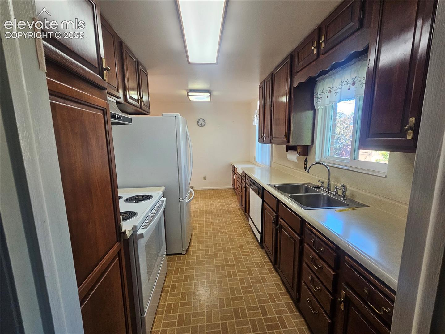kitchen with wood cabinetry. All appliances included.