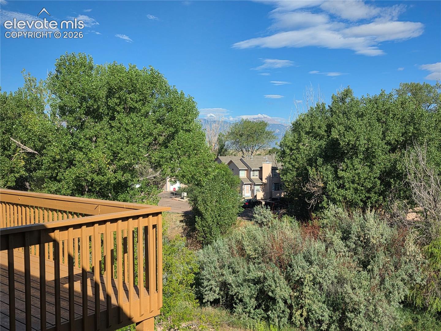 Seller provided photo of view of Pikes Peak from primary bedroom