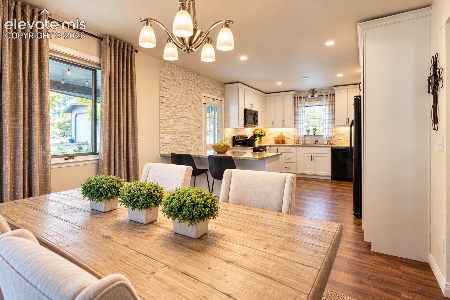 Wood-finish flooring throughout, with a stacked stone accent wall