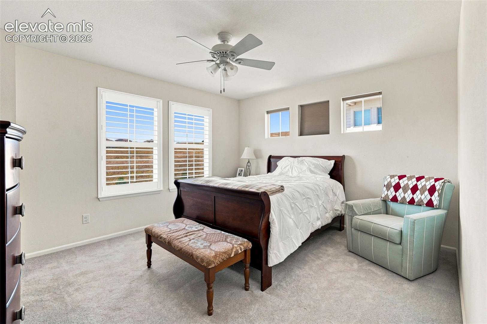 Spacious, bright and airy primary bedroom with walk-in closet