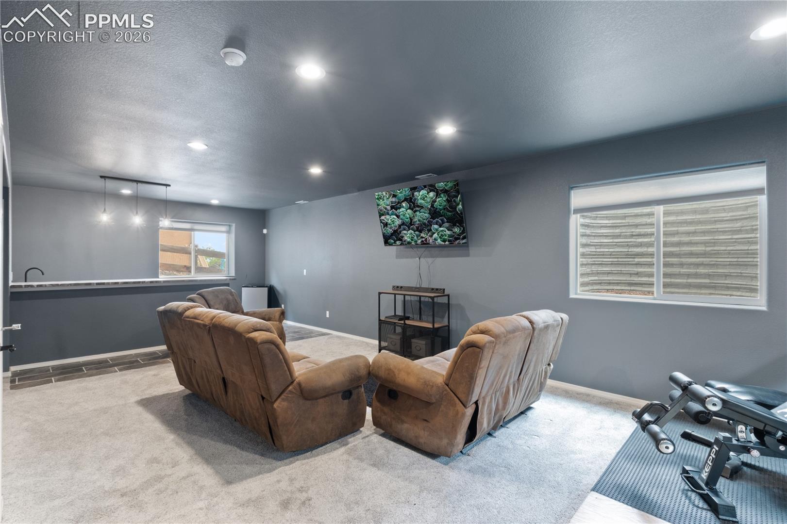 2nd Living area/media room adjacent to the wet bar.