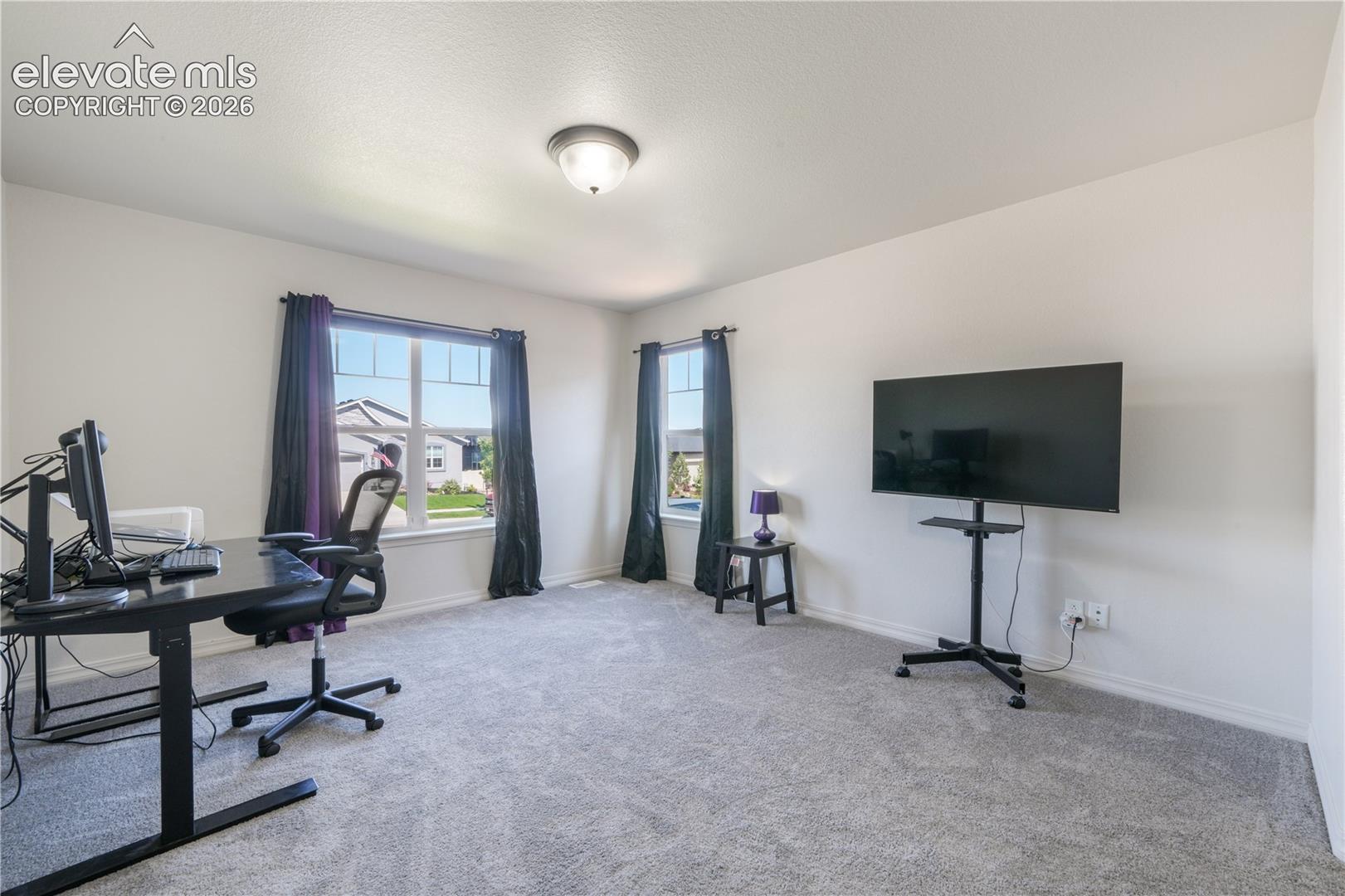 Main level 2nd bedroom with ensuite 3/4 bathroom, dual closets and new carpet