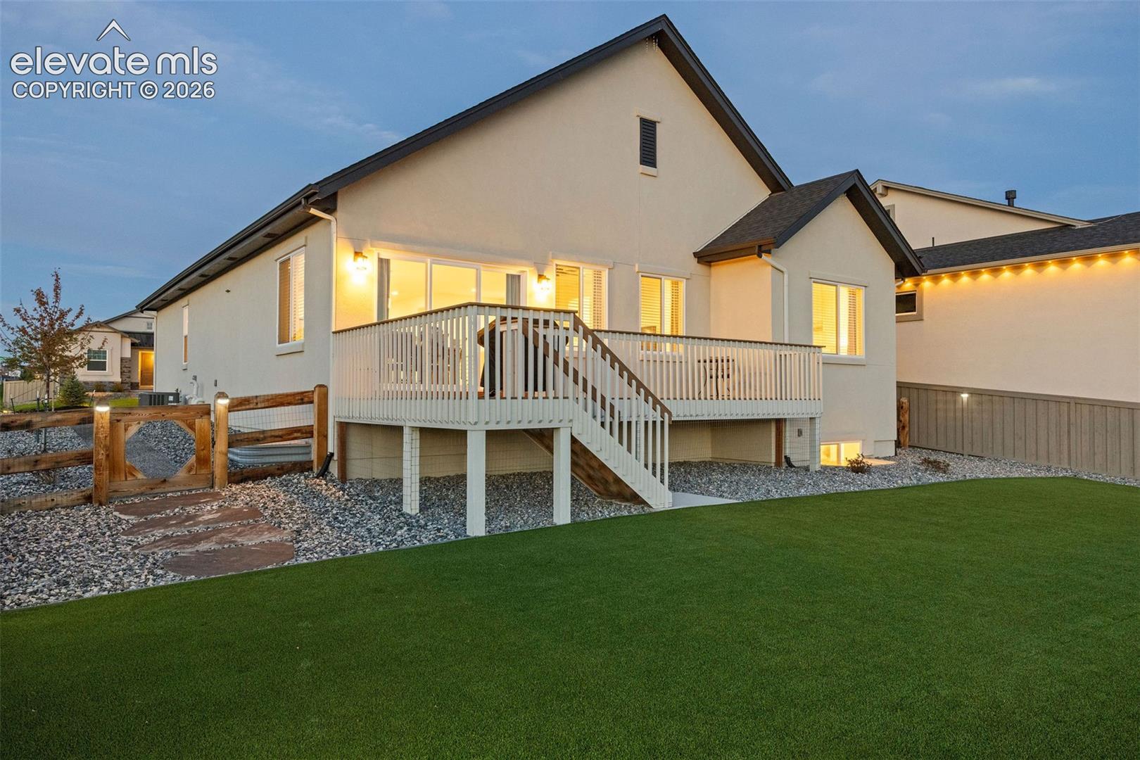 The back yard is fully fenched and the lawn is edged with xeriscaping to cut down on water use and keep maintenance easy peasy. 