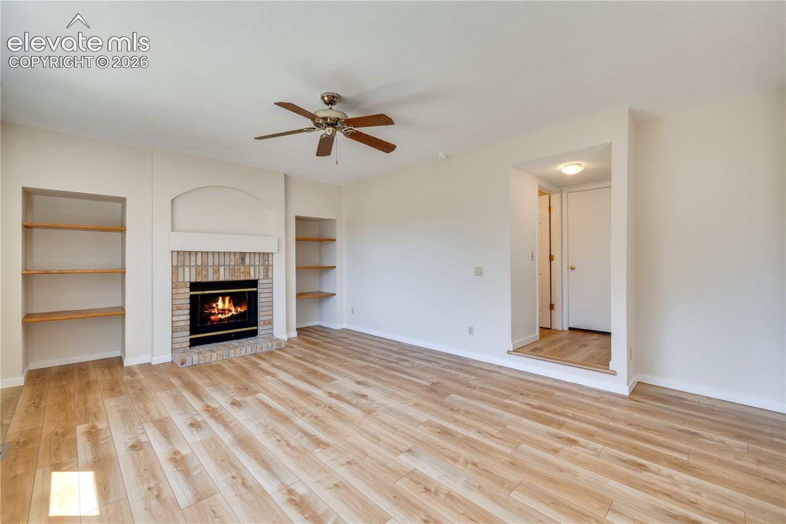 Family room has built-ins and shelves