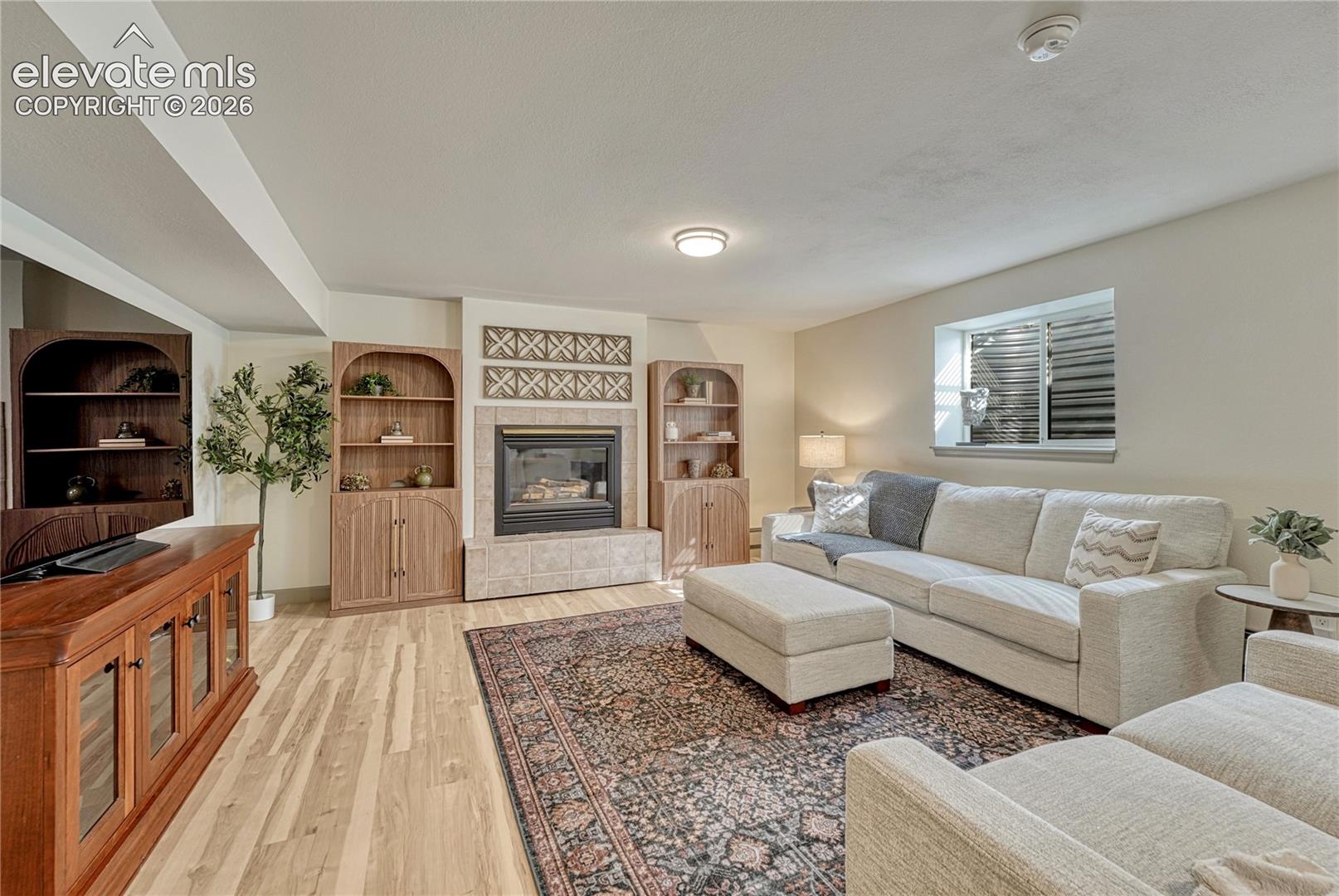 Lower level rec room with gas fireplace