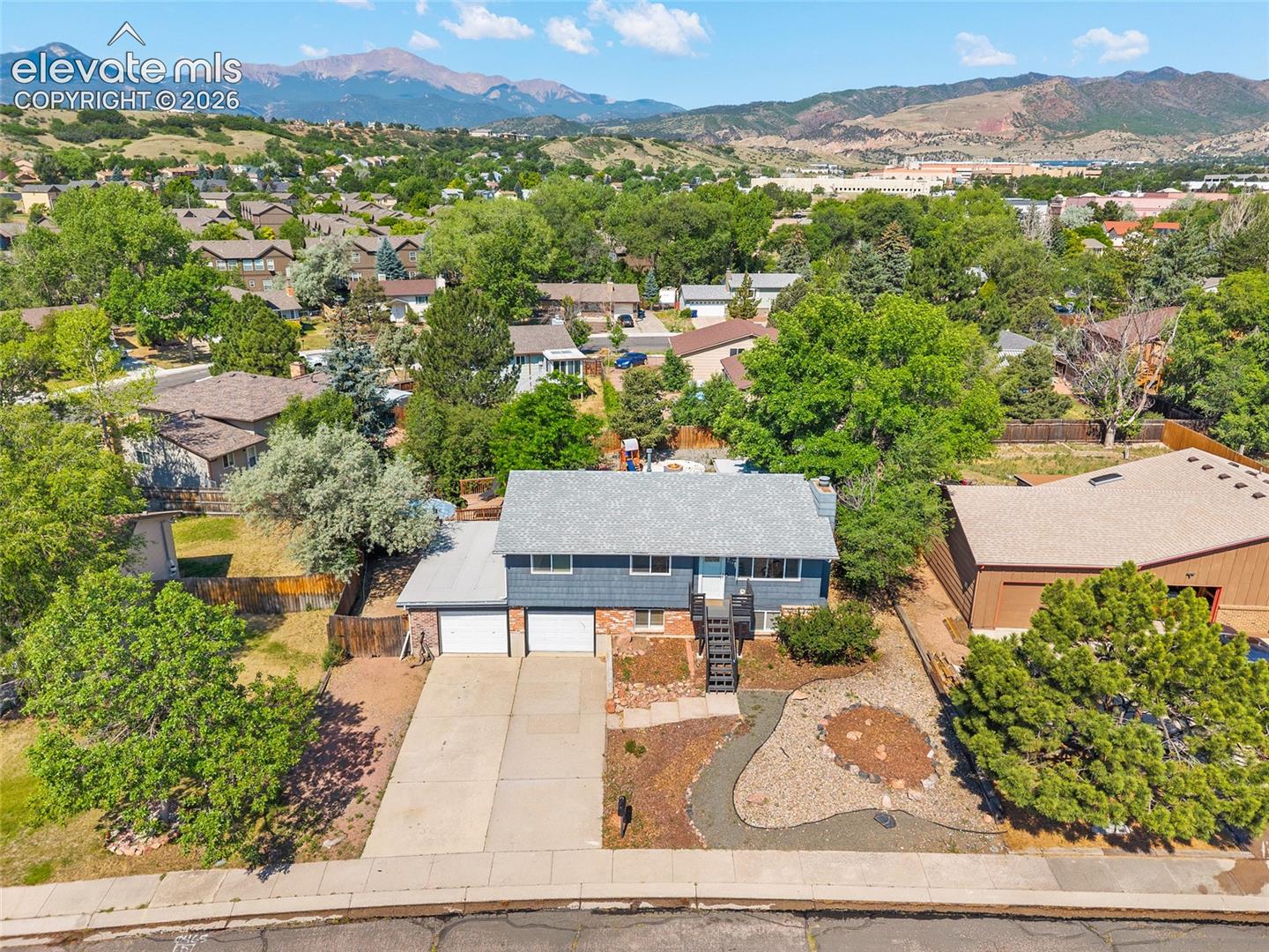 Aerial view with panoramic mountain and neighborhood views.
