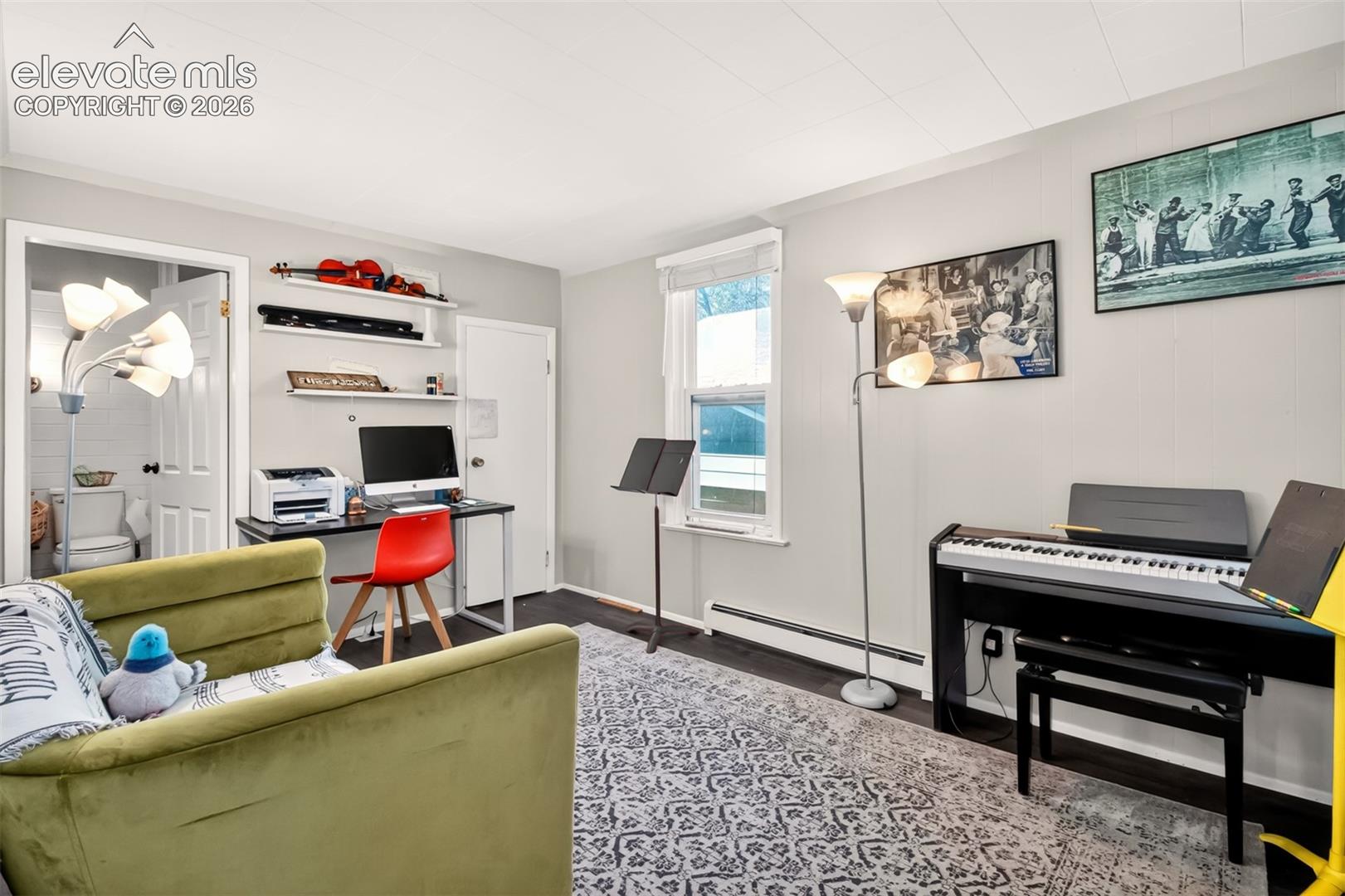Main level bedroom with closet and attached bath.