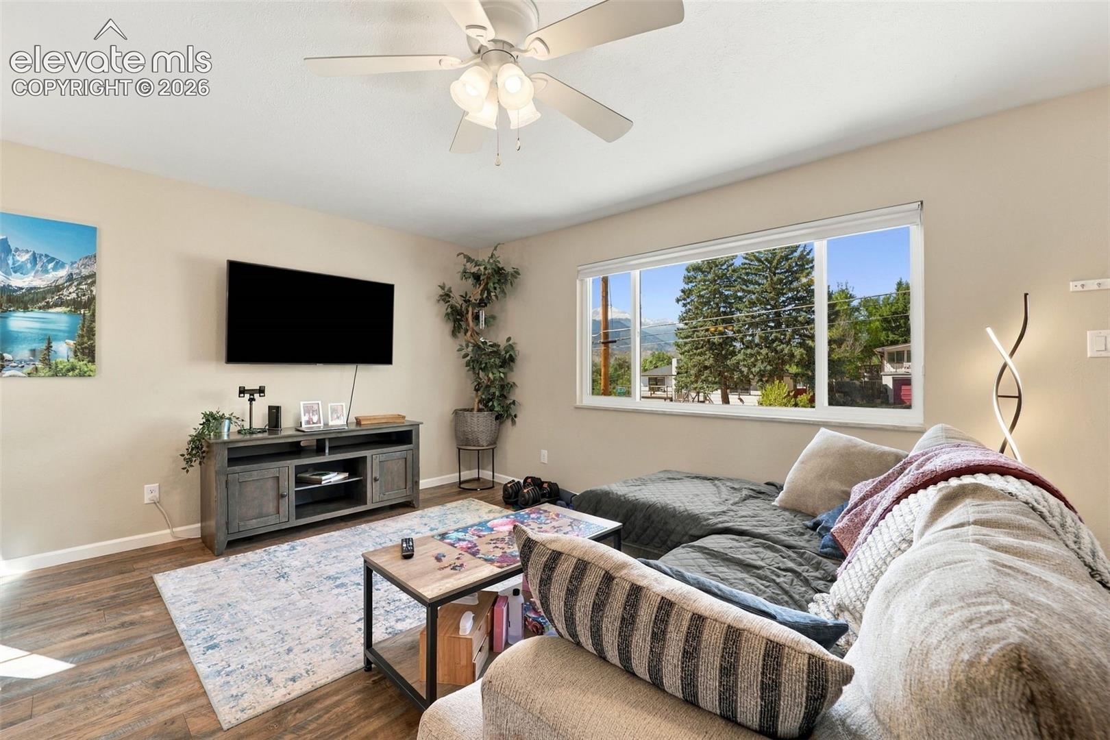 Large picture window in upper level with views of Pikes Peak! 