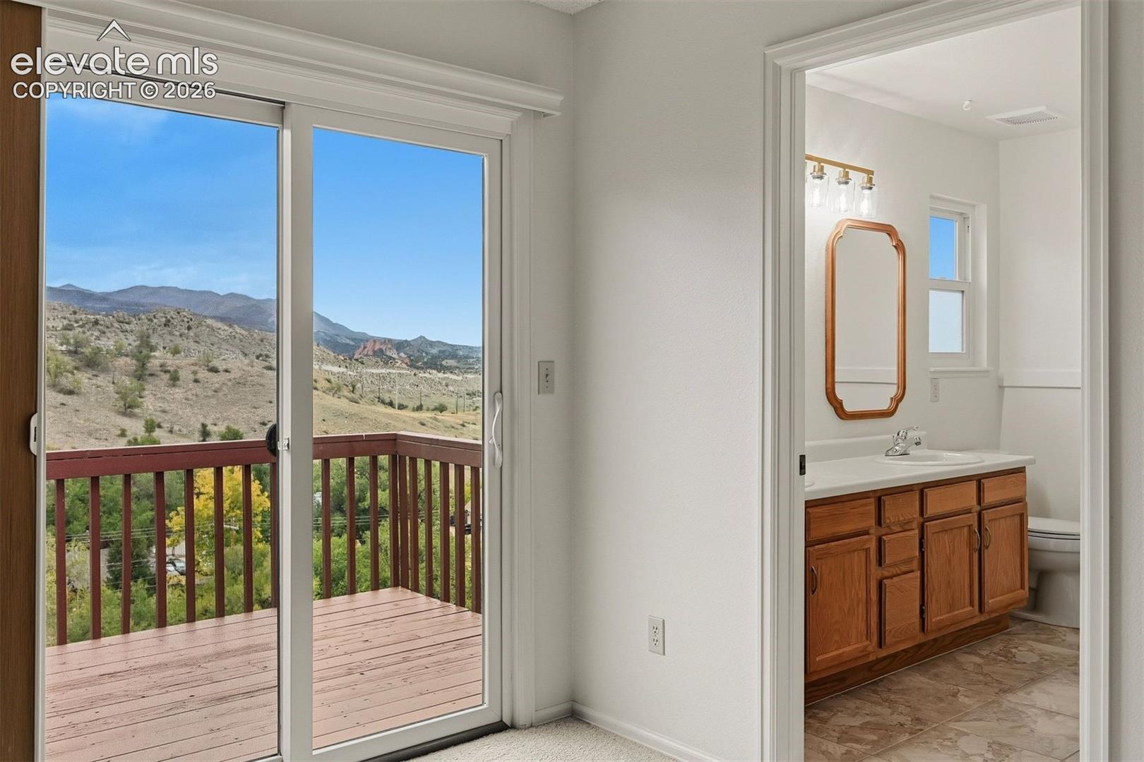 Primary bedroom walk out to private deck. 