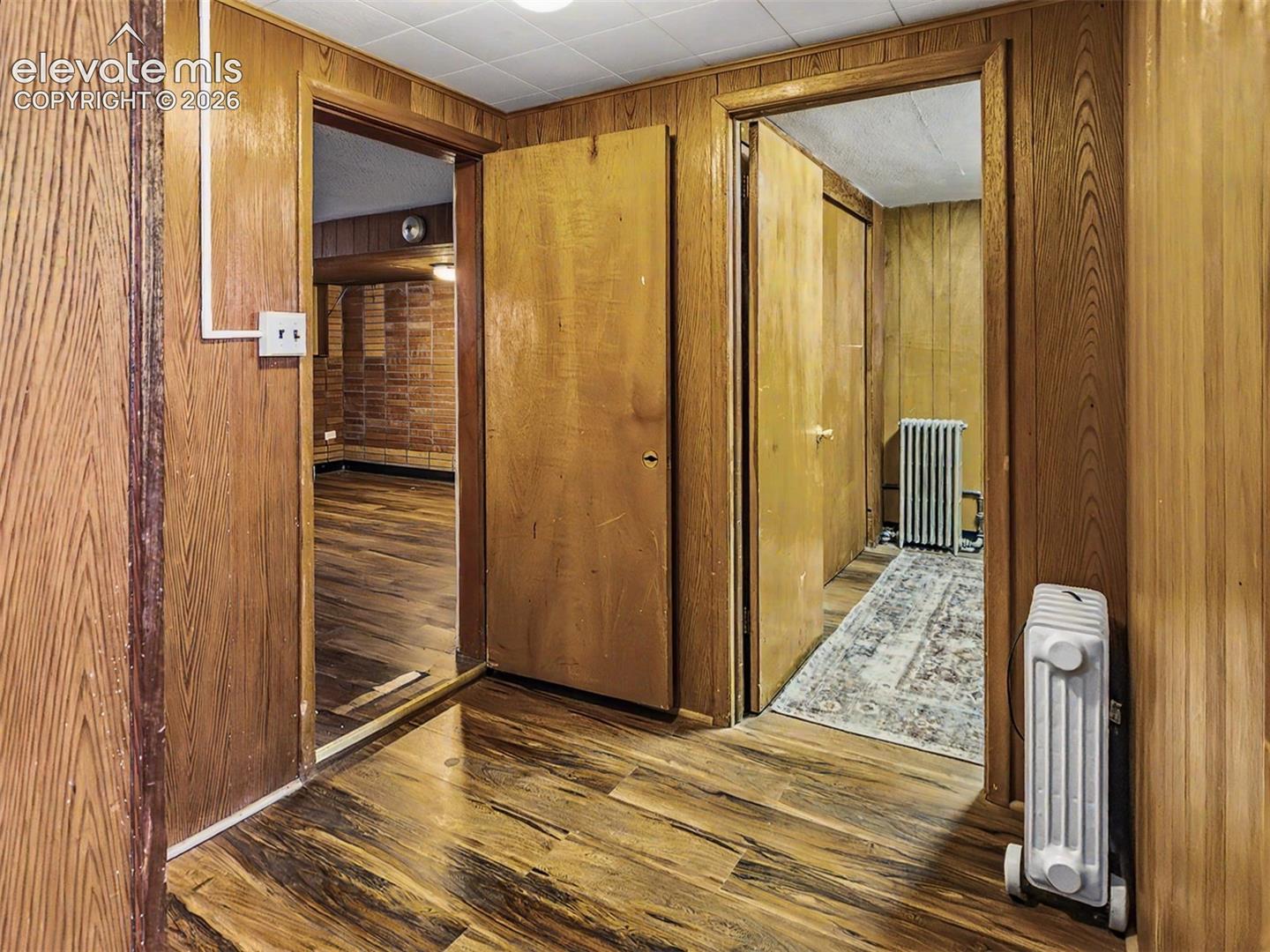 Wood-finish flooring and wood paneling throughout