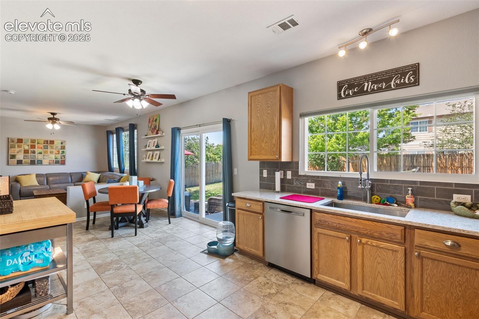 Kitchen looking towards dining area & family room with walk-out to patio.