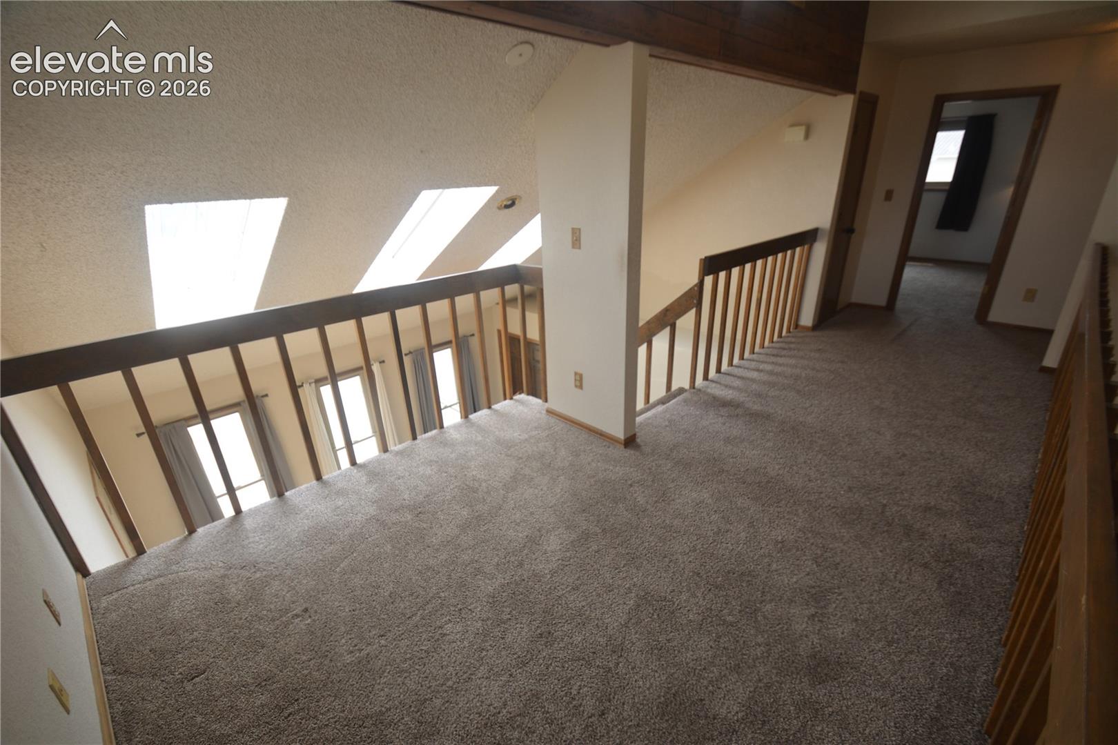 loft looking toward front door. bedroom #2 door on the right. 