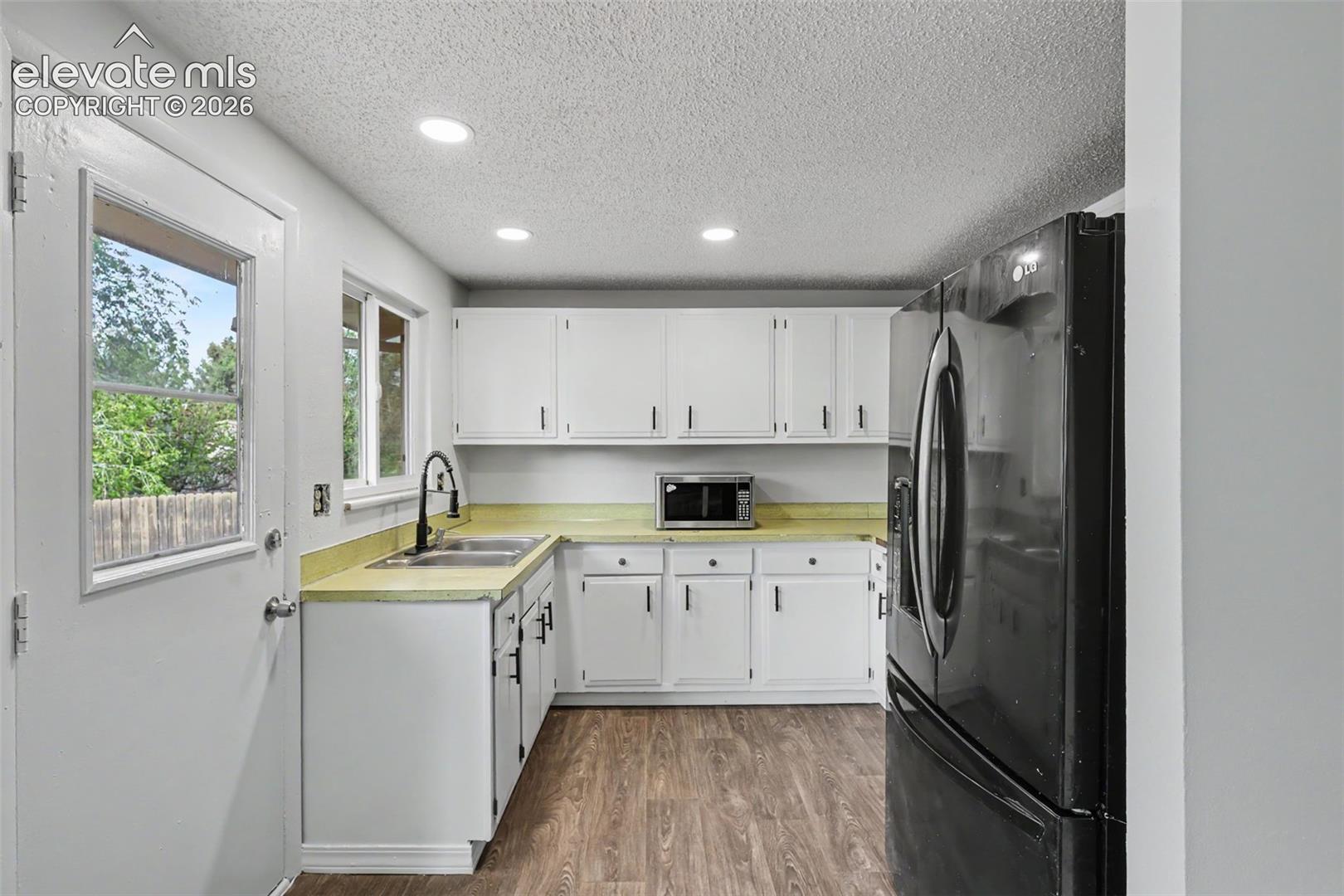 Freshly painted cabinets help give this kitchen a clean and refreshed feel.