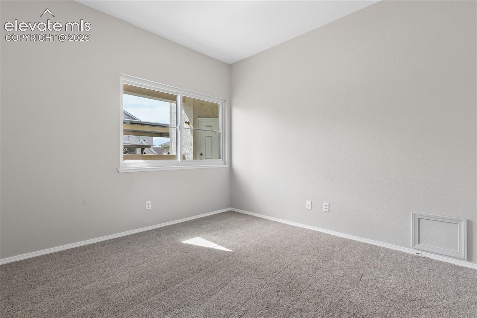 Light gray textured carpeting